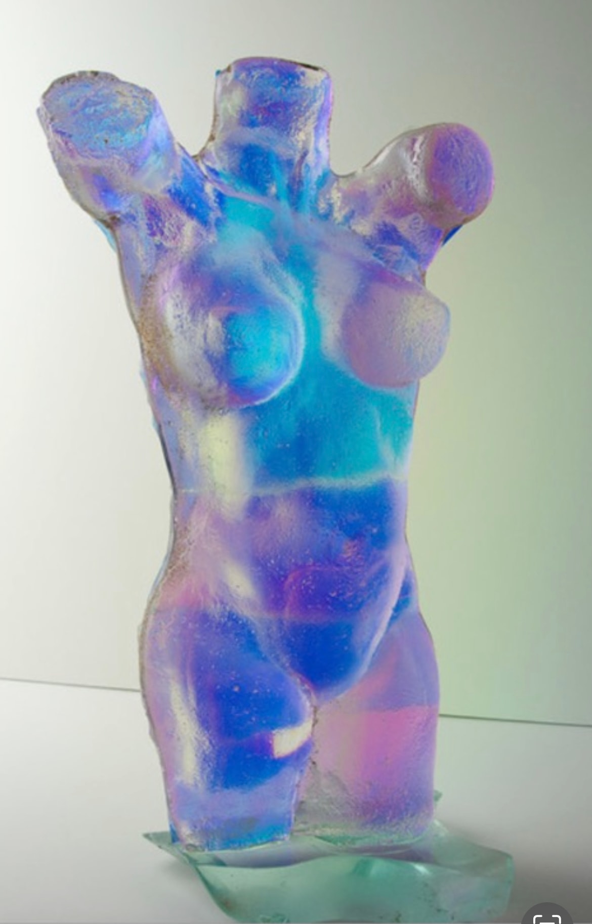 Iridescent blue glass torso sculpture