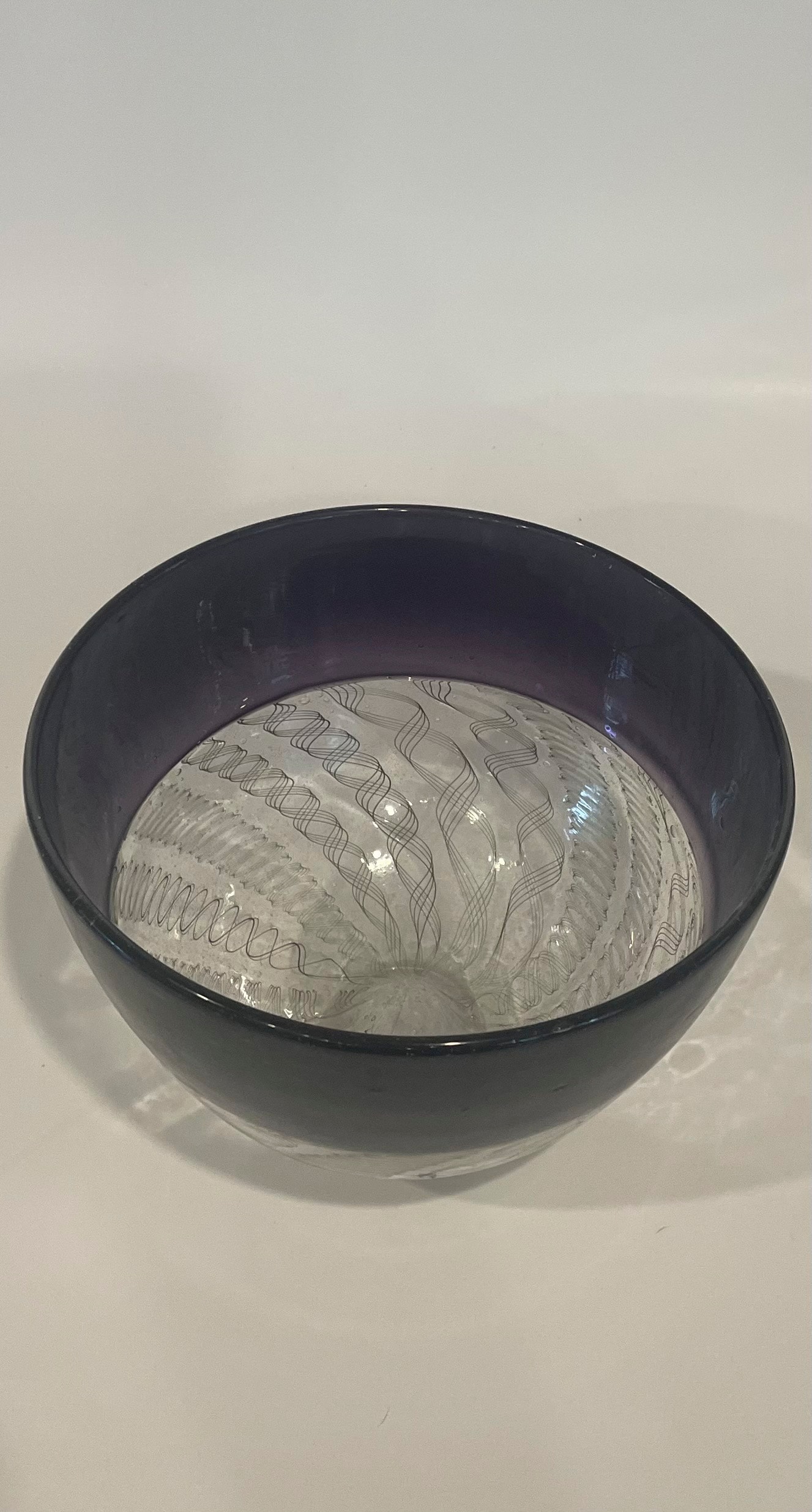 Deep purple incalmo blown glass bowl with fine line interior pattern