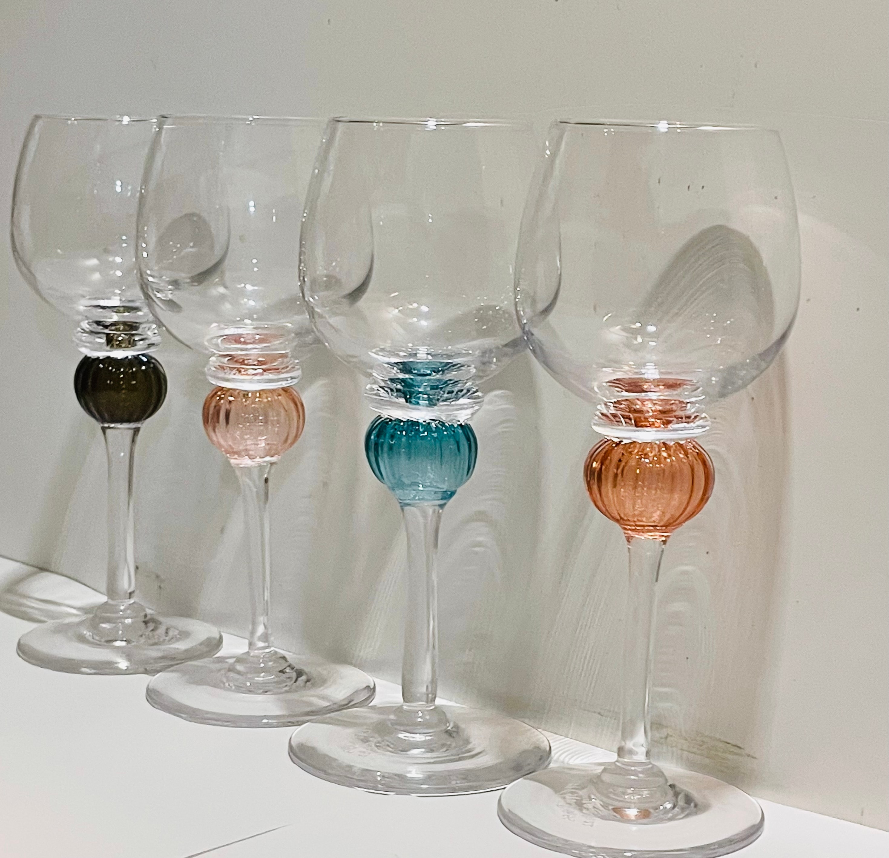 Set of four handblown goblets with colored glass sphere stems