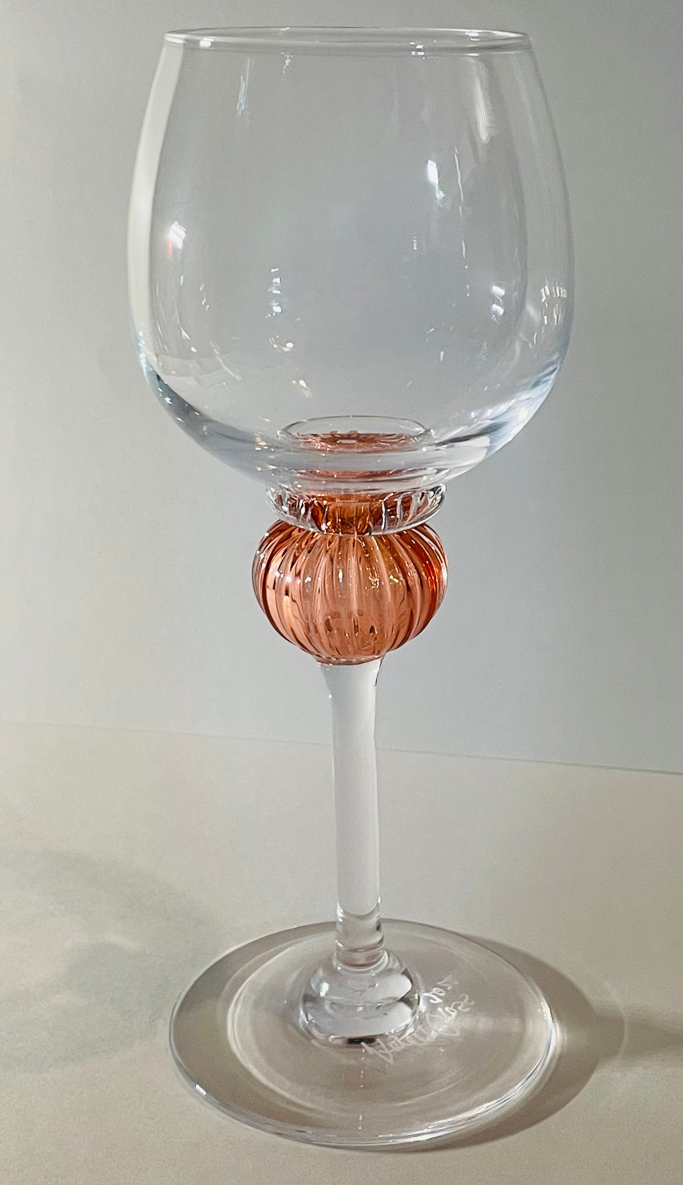 Handblown wine goblet with rose gold stem accent