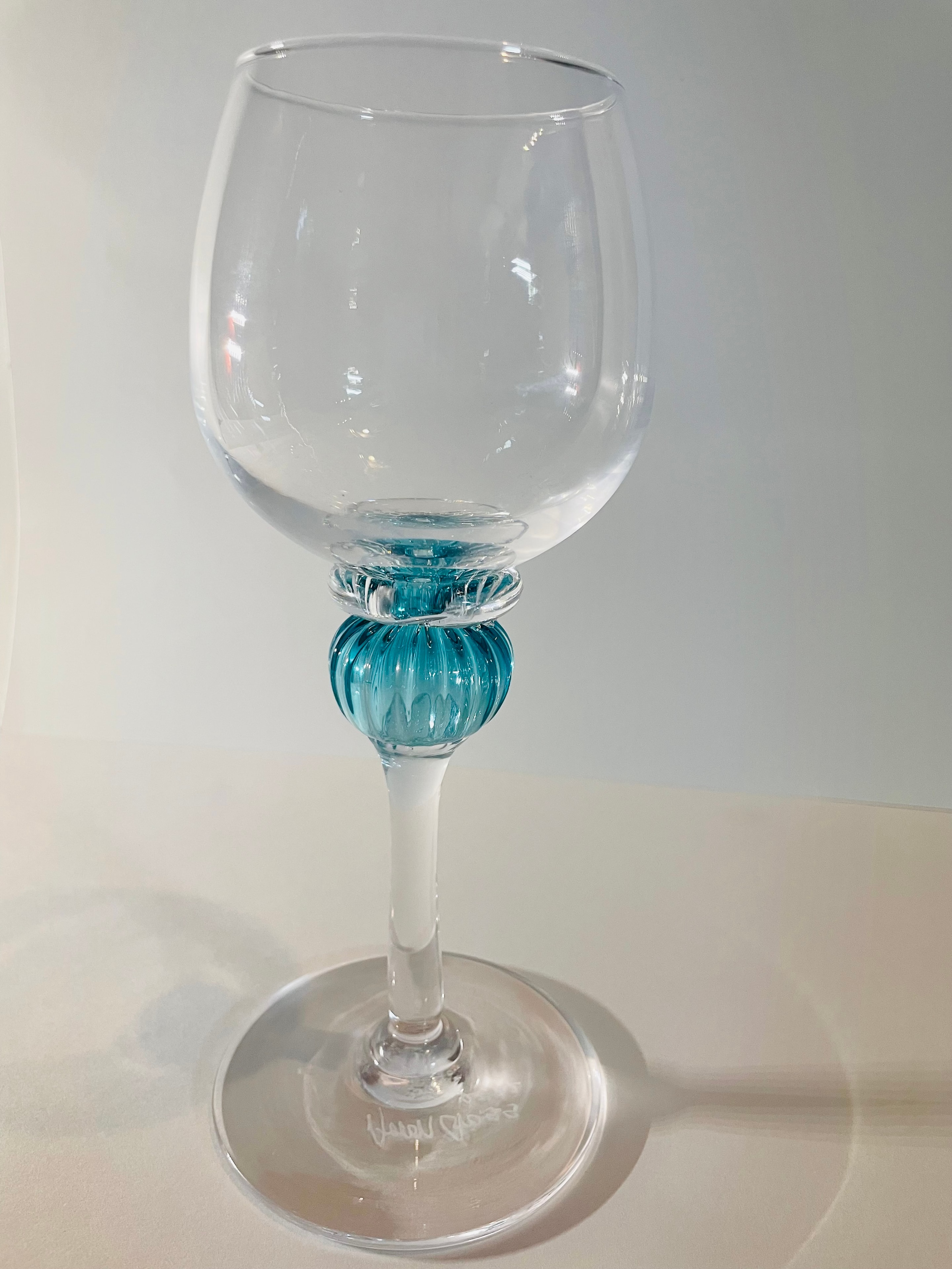 Handblown wine goblet with teal stem accent