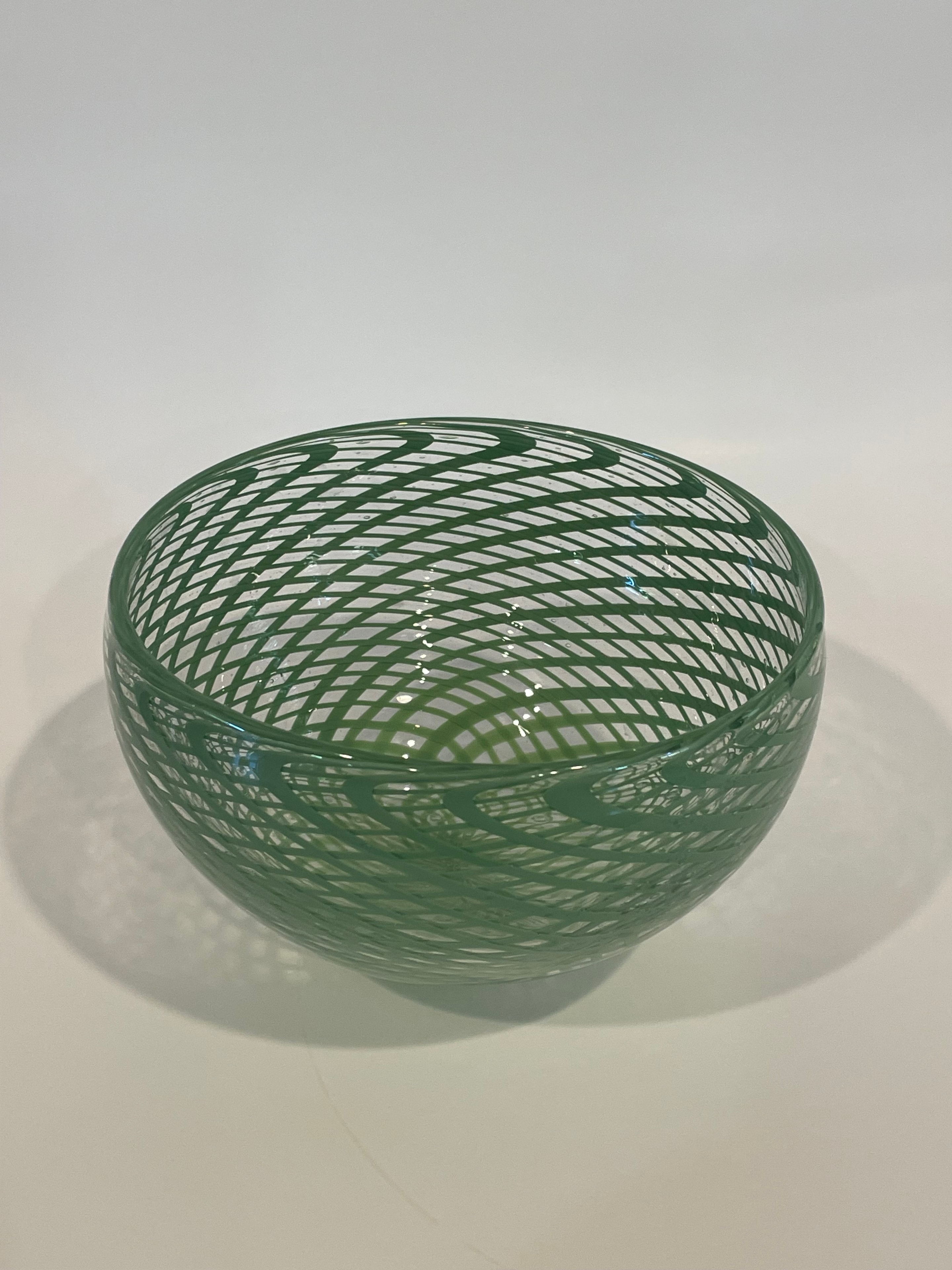 Green reticello blown glass bowl
