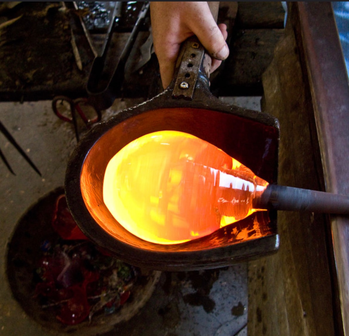 Molten glass bubble being shaped in a mold