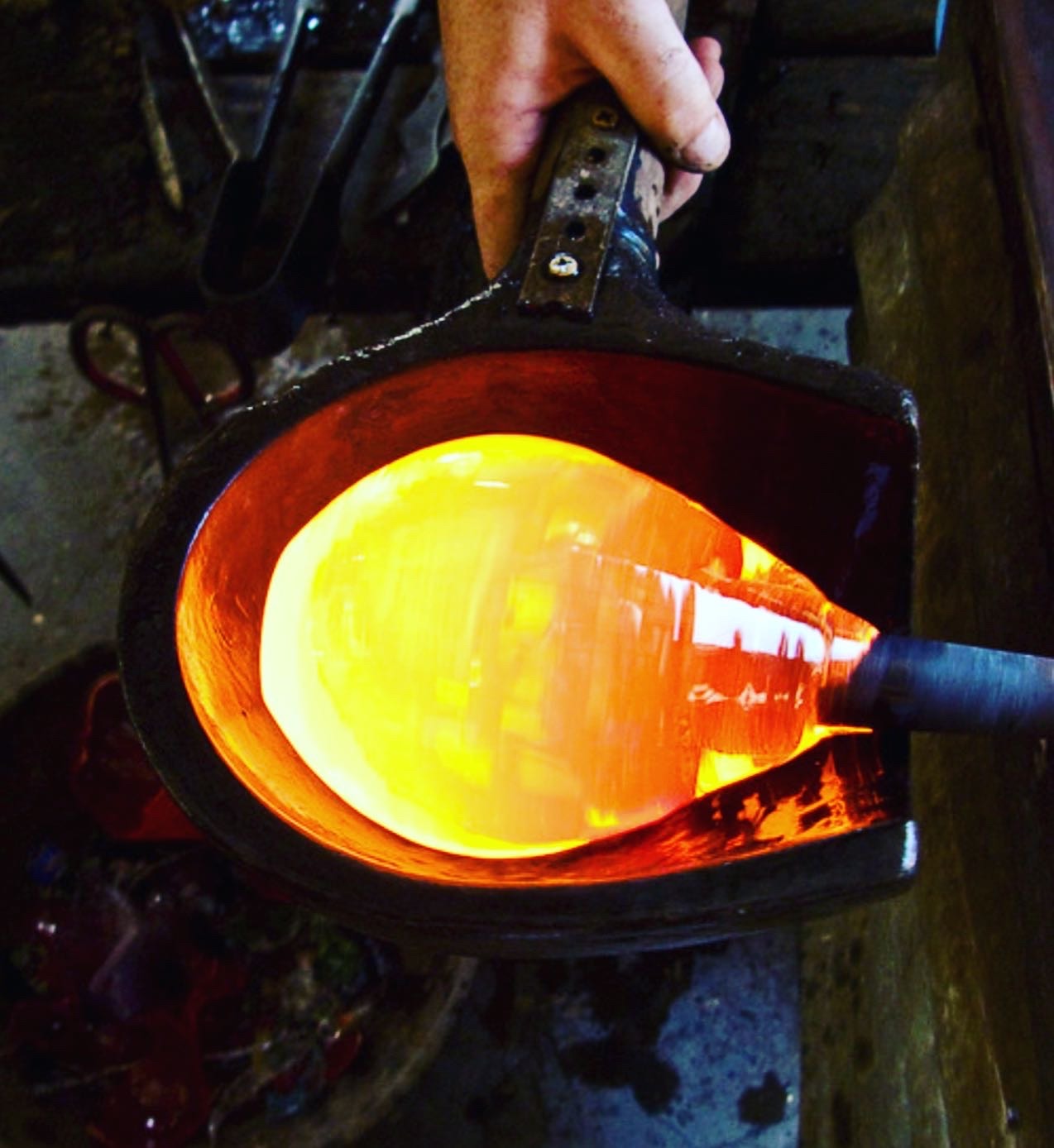 Molten glass glowing in the furnace